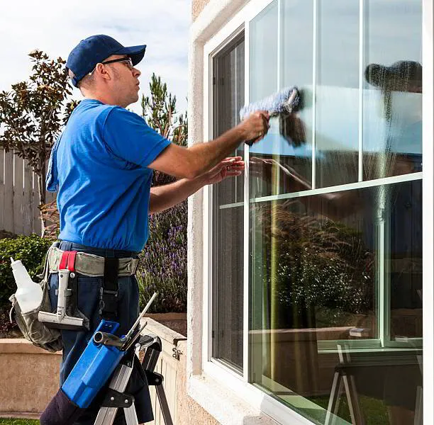 Commercial window cleaning team working on a glass facade