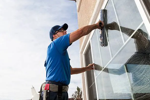 Professional commercial window cleaning service on a large office building