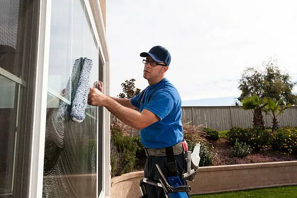 Busy Bee window cleaning team at work on residential home Massachusetts